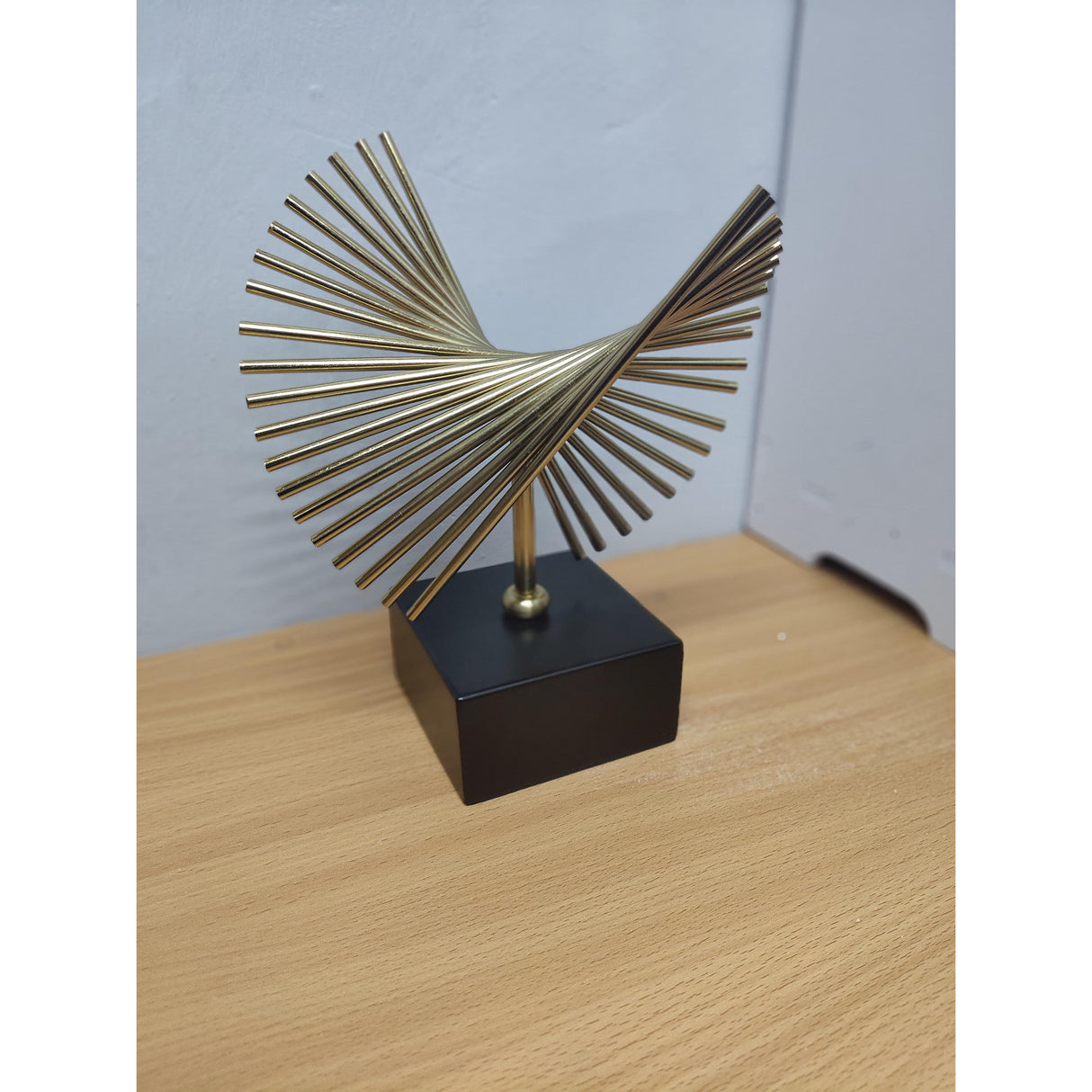 Elegant Golden Decor with Black Carbon Base