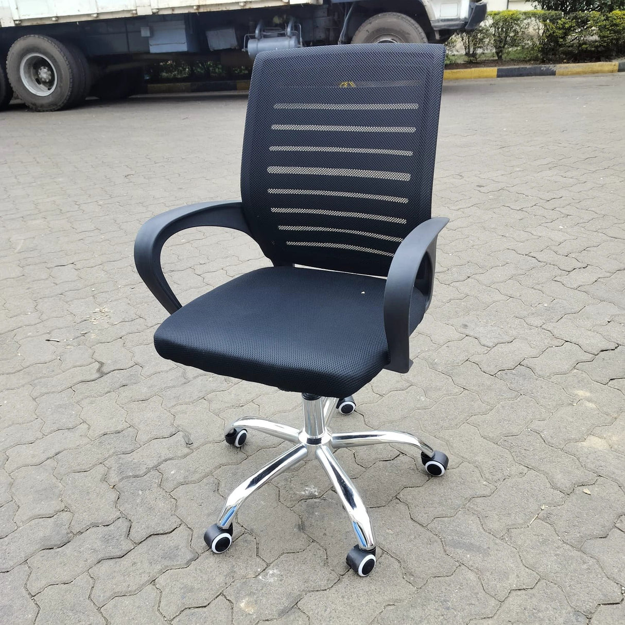 Ergonomic Black Mesh Office Chair with Chrome Base and Wheels