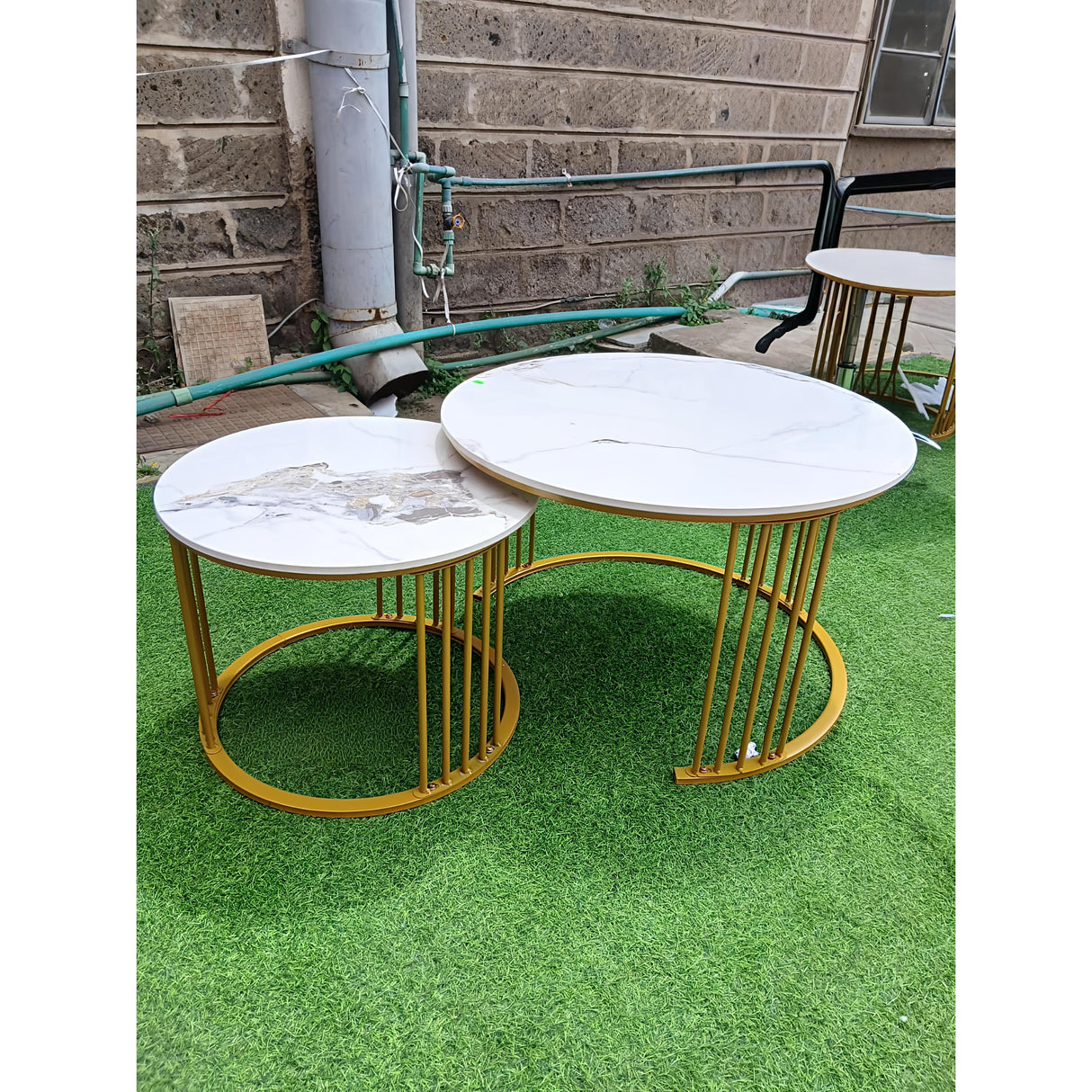Nesting Marble-Top Coffee Table Set with Gold Frame.