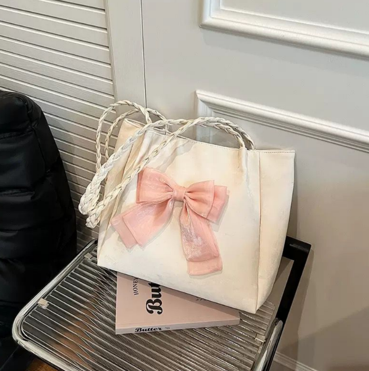 Elegant Bow Tote Bag with Braided Handles and Ribbon Detail