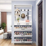 White hallway shoe rack with three open tilt-out shoe compartments displaying organised footwear, two drawers and coat hooks.