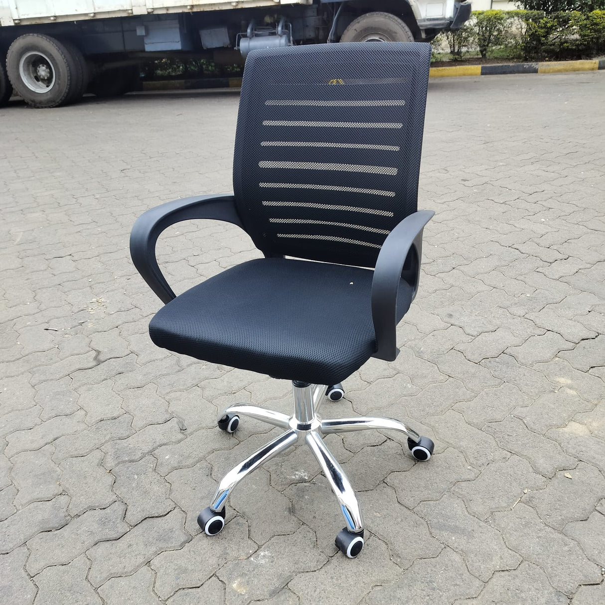 Ergonomic Black Mesh Office Chair with Chrome Base and Wheels