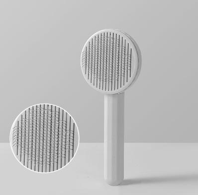 Self Cleaning Pet Comb | Stainless Steel Grooming Brush. Available in White, Pink, Blue, Grey, Green, and Yellow