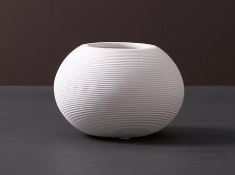 Furaha finds ceramic vase.