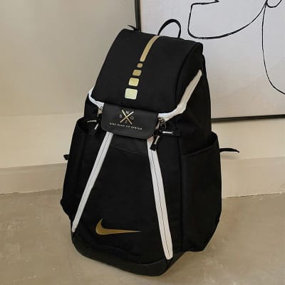 black and gold nike backpack
