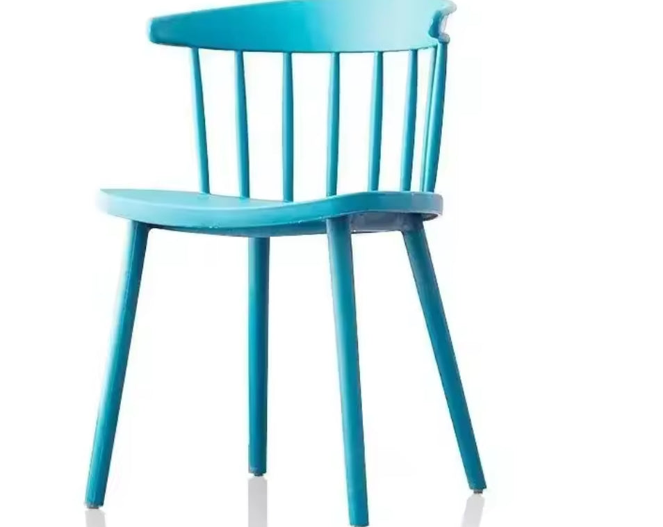 Furaha Finds modern spindle back dining chair in turquoise blue . Contemporary plastic accent chair with a sleek minimalist design