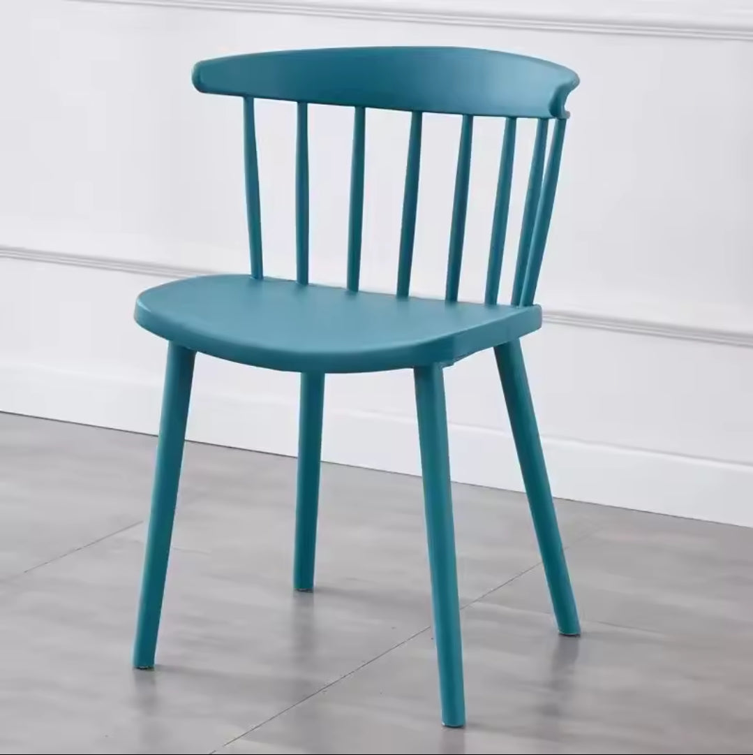 Furaha Finds modern spindle back dining chair in turquoise blue . Contemporary plastic accent chair with a sleek minimalist design