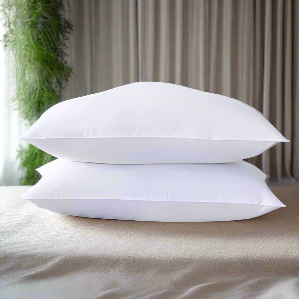 Furaha Finds Printed Hollow Bed Pillows with soft microfiber filling. Available in 1000gms and 750gsm pairs. White with stylish patterns for ultimate comfort.