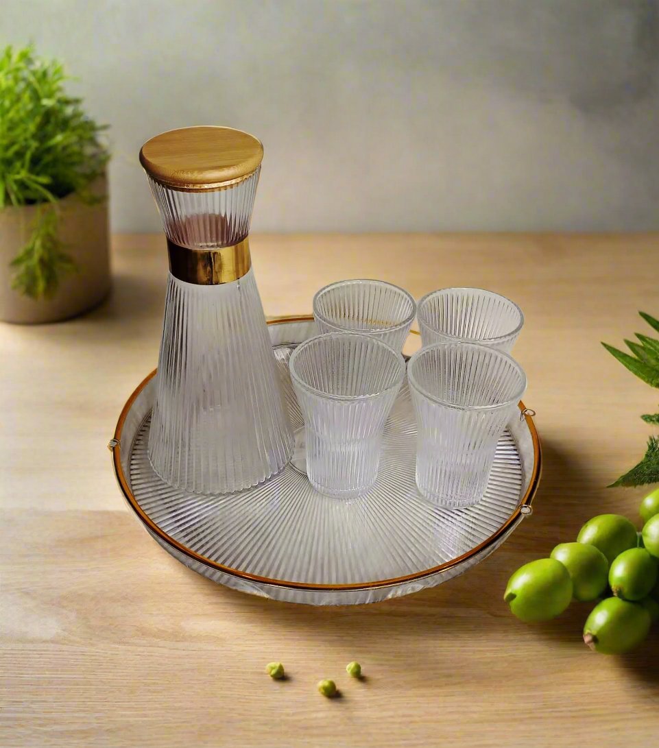 Furaha Finds Origami Textured Glass Carafe with vertical stripes, gold-accented neck, and bamboo lid. Premium 1L (34oz) crystal glass carafe for bedside, dining, and hospitality use