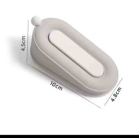 Furaha Finds Twin Door Stopper in grey. Non-slip, dual-ended wedge design for holding doors securely open or closed
