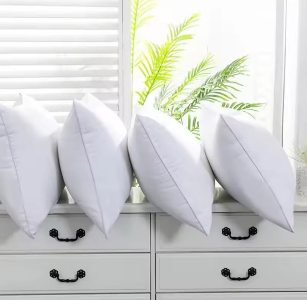 Furaha Finds Printed Hollow Bed Pillows with soft microfiber filling. Available in 1000gms and 750gsm pairs. White with stylish patterns for ultimate comfort.