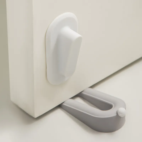 Furaha Finds Twin Door Stopper in grey. Non-slip, dual-ended wedge design for holding doors securely open or closed
