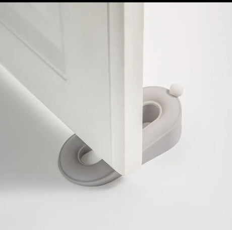 Furaha Finds Twin Door Stopper in grey. Non-slip, dual-ended wedge design for holding doors securely open or closed