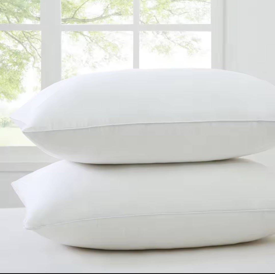 Furaha Finds Printed Hollow Bed Pillows with soft microfiber filling. Available in 1000gms and 750gsm pairs. White with stylish patterns for ultimate comfort.
